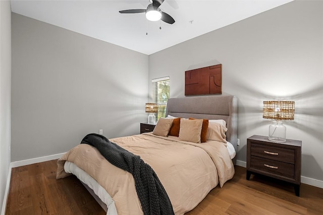 2505 Thornton Rd Unit 1312, Austin, TX 78704 - bedroom featuring baseboards, wood finished floors, and a ceiling fan