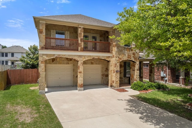 3619 Fossilwood Way, Round Rock, TX 78681 - view of front of home featuring stone siding, a balcony, concrete driveway, and an attached garage