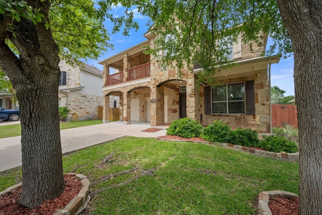 3619 Fossilwood Way, Round Rock, TX 78681 - view of front of property with stone siding, a balcony, driveway, and a garage
