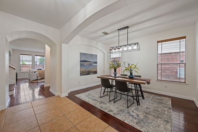 3619 Fossilwood Way, Round Rock, TX 78681 - dining room with hardwood / wood-style flooring and arched walkways