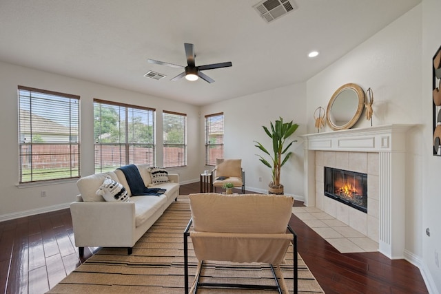 3619 Fossilwood Way, Round Rock, TX 78681 - living area with ceiling fan, hardwood / wood-style flooring, baseboards, a tiled fireplace, and recessed lighting