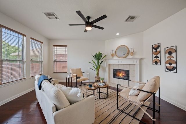 3619 Fossilwood Way, Round Rock, TX 78681 - living room with dark wood-style flooring, healthy amount of natural light, a tile fireplace, ceiling fan, and recessed lighting