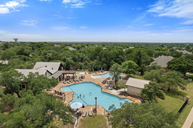 3619 Fossilwood Way, Round Rock, TX 78681 - aerial view of a pool area and a heavily wooded area