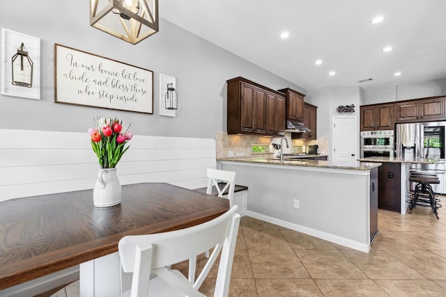 2516 Rusty Spur, Leander, TX 78641 - dining space with recessed lighting and light tile patterned flooring