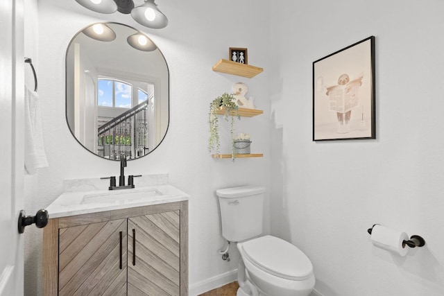 2516 Rusty Spur, Leander, TX 78641 - half bathroom featuring toilet, baseboards, and vanity