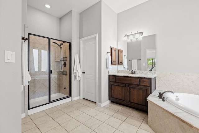2516 Rusty Spur, Leander, TX 78641 - bathroom featuring a bath, a stall shower, vanity, and tile patterned flooring