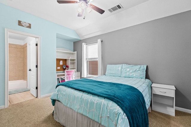 2516 Rusty Spur, Leander, TX 78641 - carpeted bedroom with baseboards, lofted ceiling, connected bathroom, and a ceiling fan