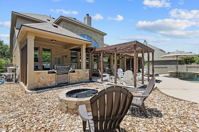 2516 Rusty Spur, Leander, TX 78641 - back of property with a fire pit, a patio, brick siding, exterior kitchen, and a chimney