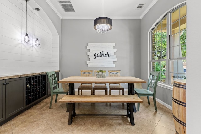 2516 Rusty Spur, Leander, TX 78641 - dining area with plenty of natural light, a chandelier, ornamental molding, light tile patterned floors, and baseboards