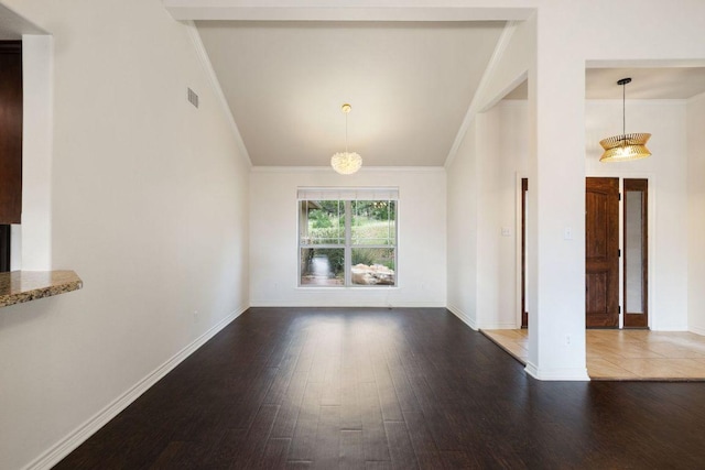 215 Maverick Cir, Horseshoe Bay, TX 78657 - unfurnished dining area with crown molding, wood finished floors, baseboards, and vaulted ceiling