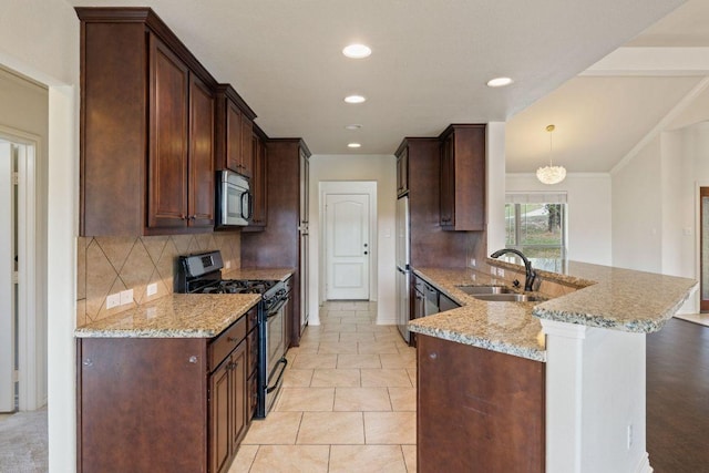 215 Maverick Cir, Horseshoe Bay, TX 78657 - kitchen featuring stainless steel appliances, a sink, light stone countertops, a peninsula, and tasteful backsplash