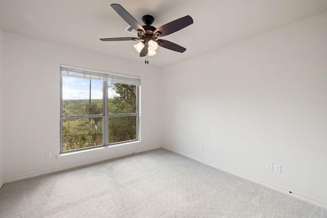 215 Maverick Cir, Horseshoe Bay, TX 78657 - empty room with a ceiling fan, baseboards, and carpet flooring