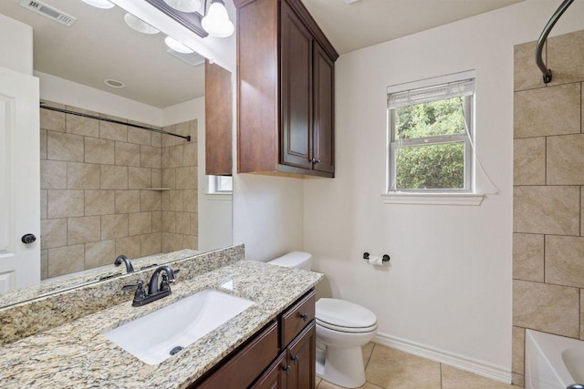 215 Maverick Cir, Horseshoe Bay, TX 78657 - full bath with toilet, tile patterned flooring, vanity, baseboards, and  shower combination