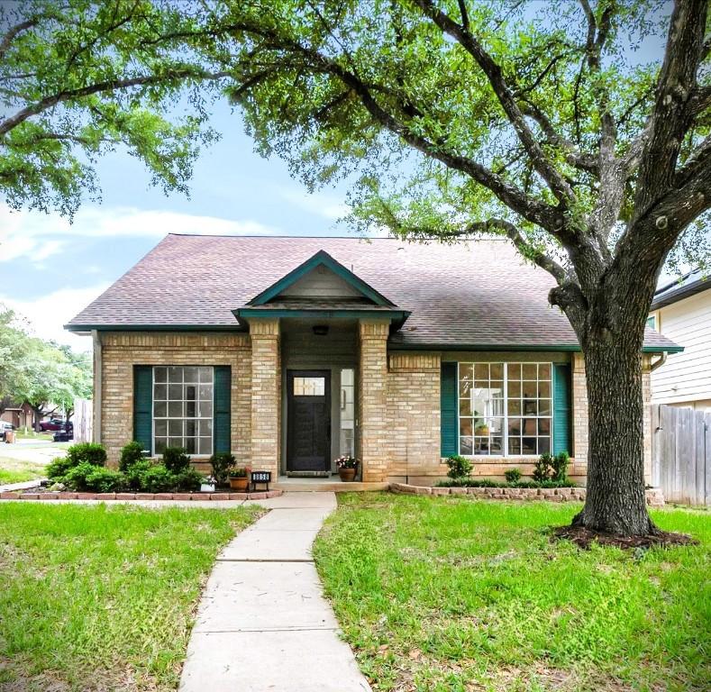 8858 Taline Cir, Austin, TX 78748 - view of front facade featuring brick siding and a shingled roof