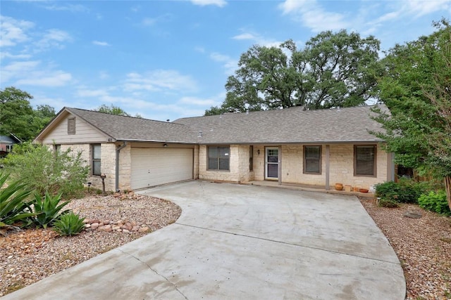 612 Tumlinson Fort Dr, Leander, TX 78641 - ranch-style home featuring stone siding, a garage, driveway, and a shingled roof