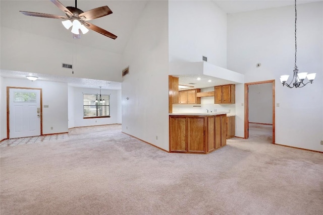 612 Tumlinson Fort Dr, Leander, TX 78641 - unfurnished living room with a chandelier, high vaulted ceiling, baseboards, and light carpet