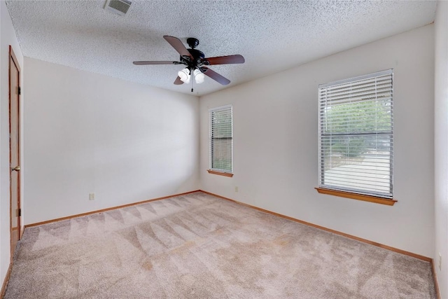 612 Tumlinson Fort Dr, Leander, TX 78641 - carpeted spare room with ceiling fan, baseboards, and a textured ceiling