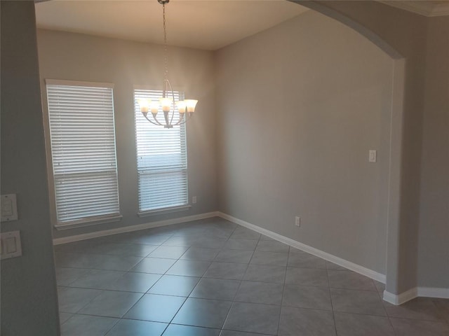 3332 Lauren Nicole Ln, Round Rock, TX 78665 - empty room featuring a chandelier, light tile patterned flooring, and arched walkways
