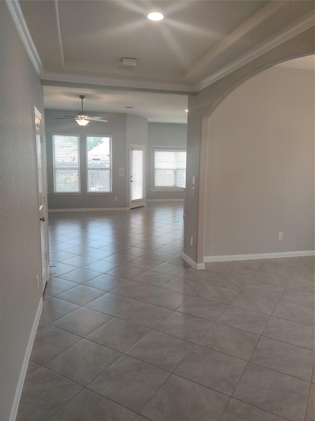 3332 Lauren Nicole Ln, Round Rock, TX 78665 - tiled empty room with arched walkways, a raised ceiling, crown molding, recessed lighting, and ceiling fan