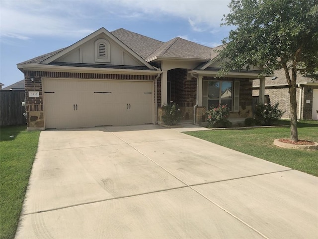 3332 Lauren Nicole Ln, Round Rock, TX 78665 - view of front of property with driveway, brick siding, an attached garage, and a shingled roof