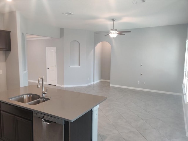 3332 Lauren Nicole Ln, Round Rock, TX 78665 - kitchen with stainless steel dishwasher, a sink, arched walkways, light tile patterned flooring, and ceiling fan