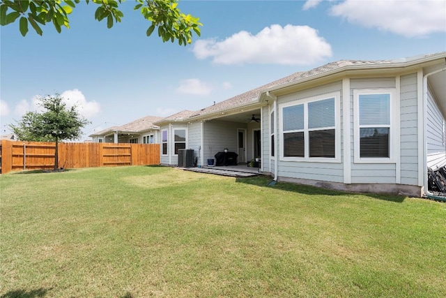 8112 Silhouette St, Austin, TX 78744 - view of yard featuring a ceiling fan, central air condition unit, and a patio area