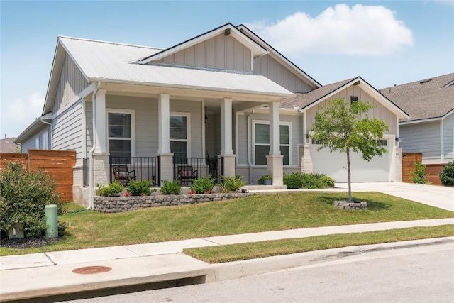 8112 Silhouette St, Austin, TX 78744 - craftsman-style house with covered porch, an attached garage, concrete driveway, and board and batten siding