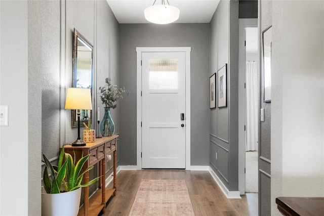 8112 Silhouette St, Austin, TX 78744 - entrance foyer featuring wood finished floors, a textured wall, and baseboards