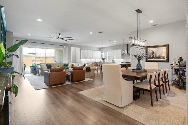 8112 Silhouette St, Austin, TX 78744 - dining room featuring recessed lighting, light wood-style floors, and ceiling fan