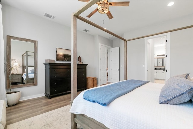 8112 Silhouette St, Austin, TX 78744 - bedroom with light wood-style floors, recessed lighting, connected bathroom, baseboards, and a ceiling fan