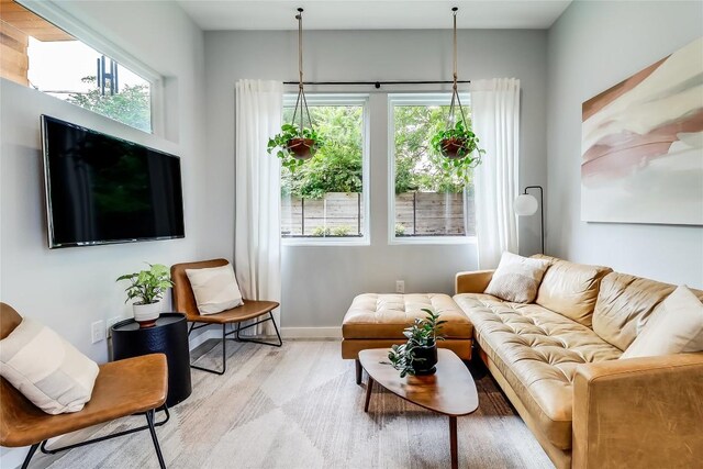 2108 Tillery St Unit 2105, Austin, TX 78723 - living area featuring wood finished floors and baseboards