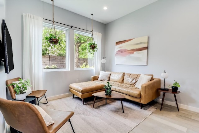 2108 Tillery St Unit 2105, Austin, TX 78723 - living room with baseboards, light wood finished floors, and recessed lighting