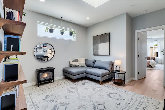 2108 Tillery St Unit 2105, Austin, TX 78723 - living room featuring baseboards, recessed lighting, and light wood-style flooring