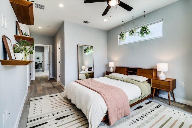 2108 Tillery St Unit 2105, Austin, TX 78723 - bedroom featuring baseboards, wood finished floors, recessed lighting, and ceiling fan