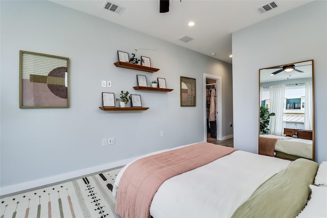 2108 Tillery St Unit 2105, Austin, TX 78723 - bedroom with recessed lighting, a spacious closet, ceiling fan, and baseboards