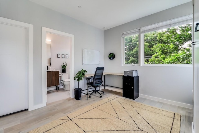 2108 Tillery St Unit 2105, Austin, TX 78723 - home office with wood finished floors and baseboards