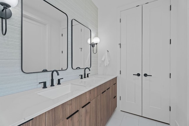 2114 Haskell St, Austin, TX 78702 - full bath featuring double vanity and tile patterned flooring