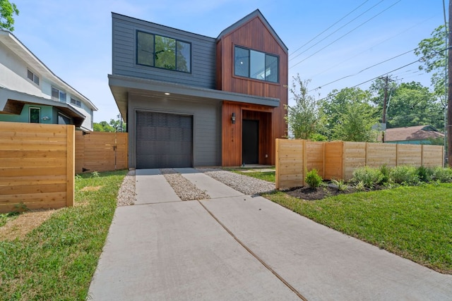 2114 Haskell St, Austin, TX 78702 - contemporary home with concrete driveway and a garage