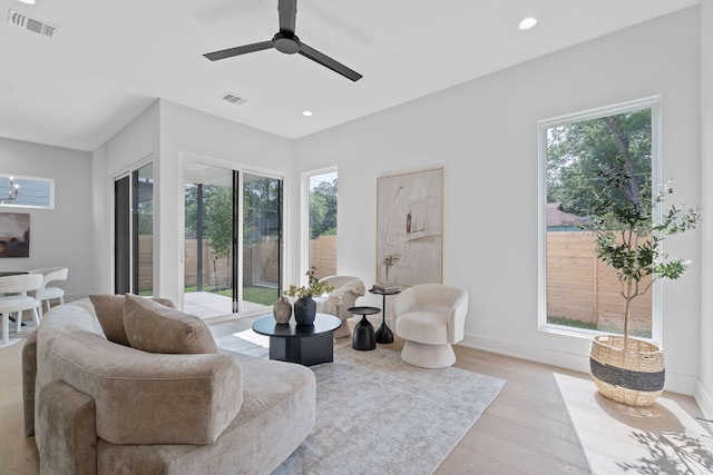 2114 Haskell St, Austin, TX 78702 - living area featuring light wood finished floors, ceiling fan, and recessed lighting