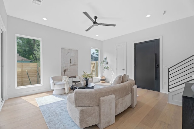 2114 Haskell St, Austin, TX 78702 - living area with stairs, light wood finished floors, a ceiling fan, and recessed lighting