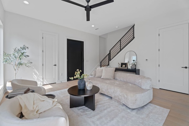 2114 Haskell St, Austin, TX 78702 - living area with wood finished floors, ceiling fan, stairs, and recessed lighting
