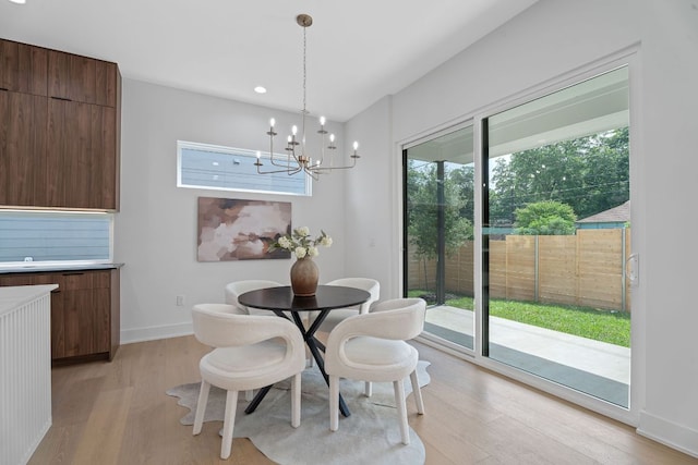 2114 Haskell St, Austin, TX 78702 - dining space featuring light wood-style flooring, a chandelier, and recessed lighting