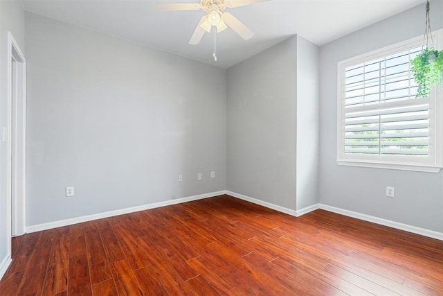 11203 Ranch Road 2222 1501, Austin, TX 78730 - unfurnished room featuring wood finished floors, baseboards, and a ceiling fan