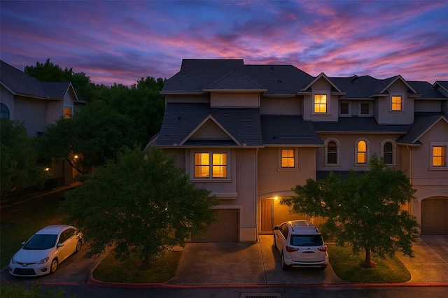 11203 Ranch Road 2222 1501, Austin, TX 78730 - view of front of house featuring stucco siding, driveway, and a garage