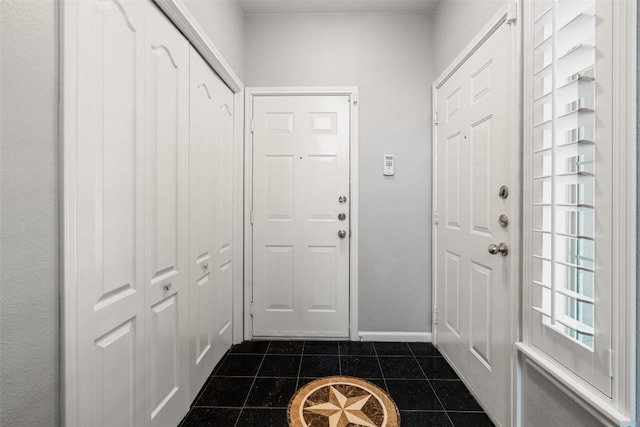 11203 Ranch Road 2222 1501, Austin, TX 78730 - entryway featuring dark tile patterned flooring and baseboards