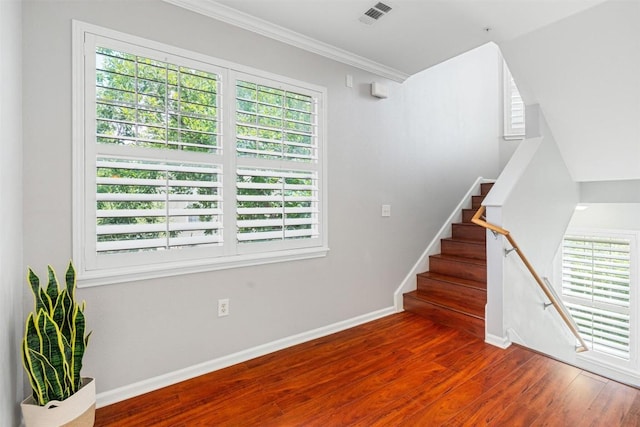 11203 Ranch Road 2222 1501, Austin, TX 78730 - stairs featuring healthy amount of natural light, wood finished floors, baseboards, and crown molding