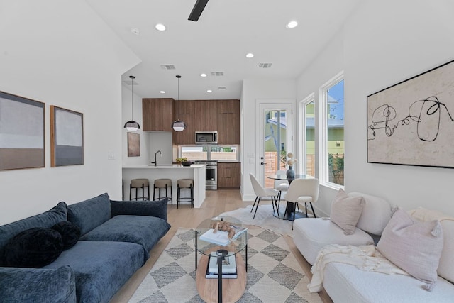 52 Robert T Martinez Jr St, Austin, TX 78702 - living room featuring recessed lighting and light wood-type flooring