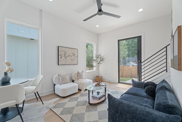 52 Robert T Martinez Jr St, Austin, TX 78702 - living room featuring light wood-type flooring, stairway, recessed lighting, baseboards, and a ceiling fan