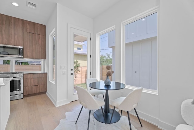 52 Robert T Martinez Jr St, Austin, TX 78702 - dining area with light wood-type flooring and baseboards