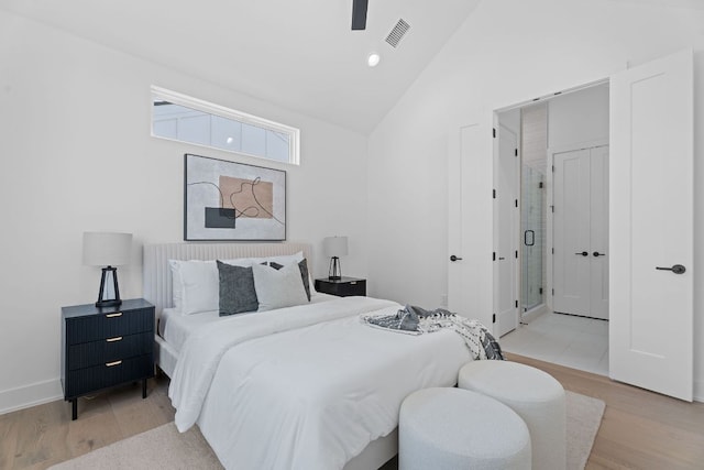 52 Robert T Martinez Jr St, Austin, TX 78702 - bedroom with wood finished floors, high vaulted ceiling, baseboards, and recessed lighting